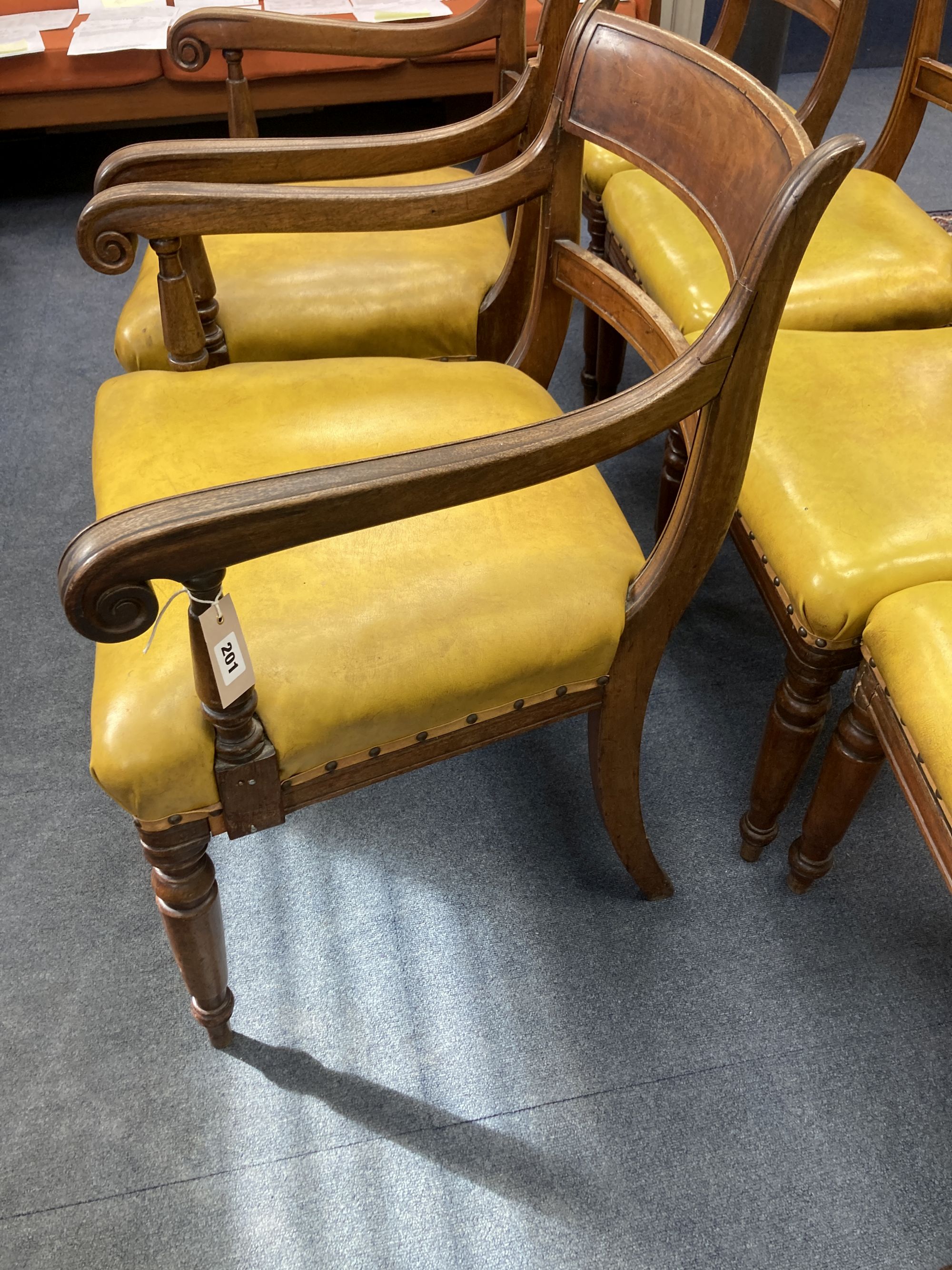 A set of six early Victorian mahogany dining chairs, two with arms